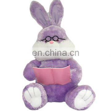 Wearing glassese and reading a book Plush Easter Rabbit Toys min purple color