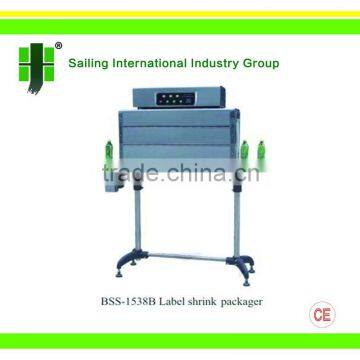 Label shrink packager for bottle packaging