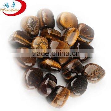 Natural polished tiger eye tumbled stone for decor, healing and meditation