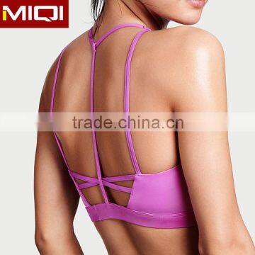 Active wear wholesale sexy strappy back design sports bra for women                        
                                                                                Supplier's Choice