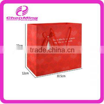 Yiwu wholesale red handle clothing paper bag