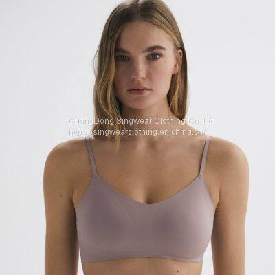 Ladies' santoni seamless knit quick dry & wicking cross back mid support sports bra.