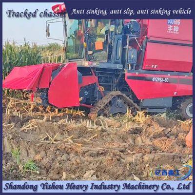 Corn harvester modified with triangular track wheel anti sinking half chain rail