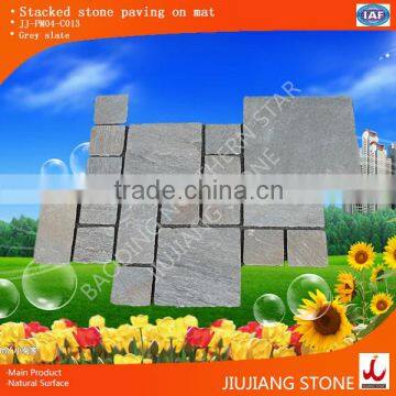 Interlocking natural stone paving on mat