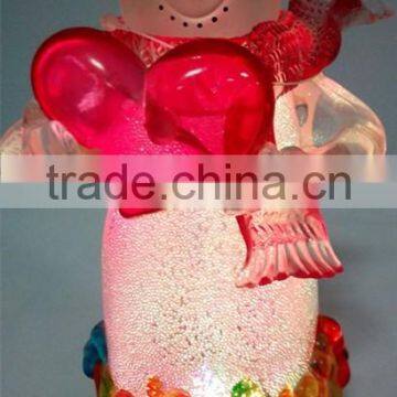 Holding a Red Heart Acrylic Snowman With LED Light photo-4