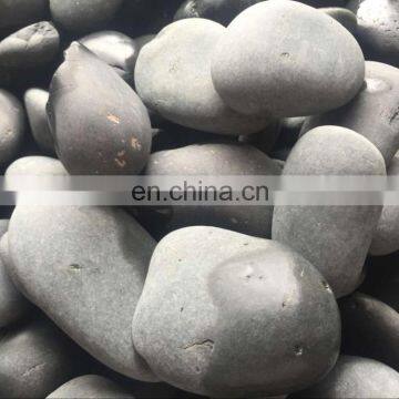 Flat round grey river stones