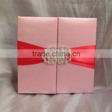 Hot sale luxurious pink silk hardcover wedding invitations with red ribbons&rhinestone brooches