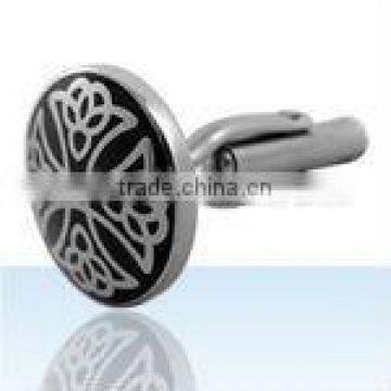 Pair of round steel cufflinks with black enamel cross / flower design