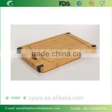 Heavy Duty Bamboo wood Cutting Board with Non Slip Silicone Corner Tabs and Juice Groove and handle