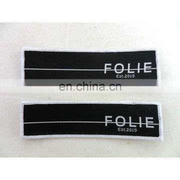 custom black polyester garment centerfold woven label