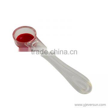 Colorful plastic tasting spoon