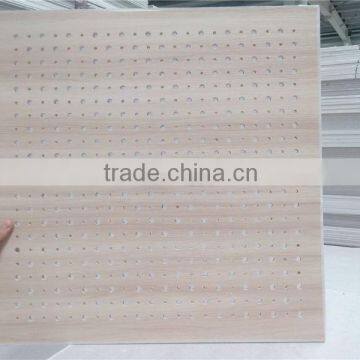 suspended perforated acoustic gypsum ceiling with round cross hole