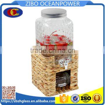 embossing surface glass beverage dispenser on grass stand