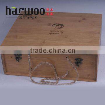 Engaving and caving bamboo box with rope handle