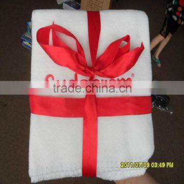 Fine polyester fleece gift blanket with ribbon bound packaging