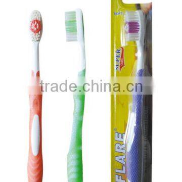 Oral care toothbrush with tongue cleaner