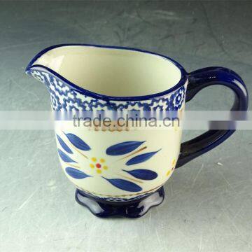 China factory unique shaped ceramic cup with handle, cheap stock porcelain cup for wholesale