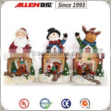 8.3" reindeer resin figurine with Christmas Santa and fireplace mini scene