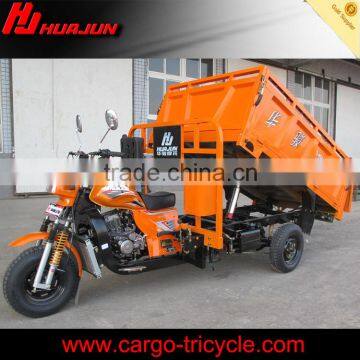 Cargo carrying tricycle with hydraulic hopper loading