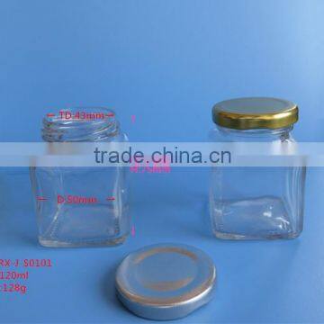 Small empty square glass honey jar with metal lid