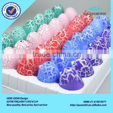 Wholesale colorful green pink red blue purple crack hatching and growing dinosaur egg toys in stock