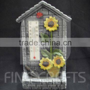 Cement sunflower standing bird feeder with weatherglass