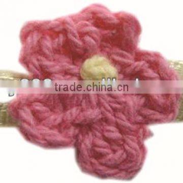 crochet flower with ribbon leaf