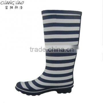 Women fashion rubber rain boot has navy bule and white stripes printed without buckle and sole