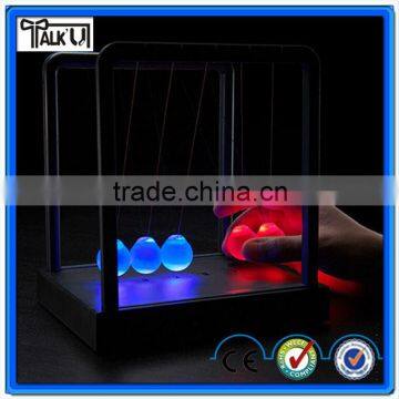 Hot sell plastic base kinetic Newton cradle balance balls, battery powered color changing Newton Pendulum balance ball