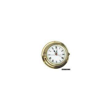 Art. 2141 Clock set into brass marine case with opening face