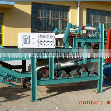 Sludge dewatering belt filter press