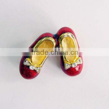 red slippers metal brooches