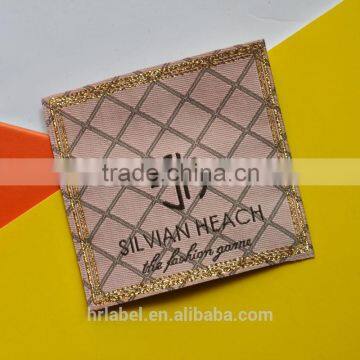 damask woven label for fashion garment with metallic rulex thread