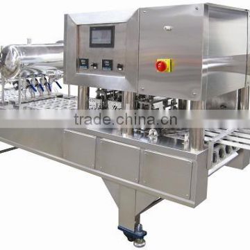 Pneumatic cup filling and sealing machine