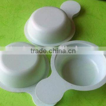 white disposable plastic tray for urine testing.