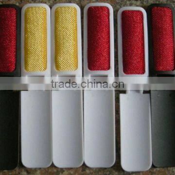 Plastic travelling lint brush