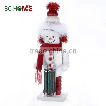 exquisitely crafted snow man wooden Nutcracker with sleigh