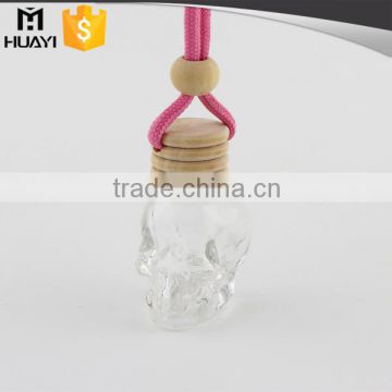 wooden cap skull shape glass car diffuser glass bottle 10ml                        
                                                                                Supplier's Choice