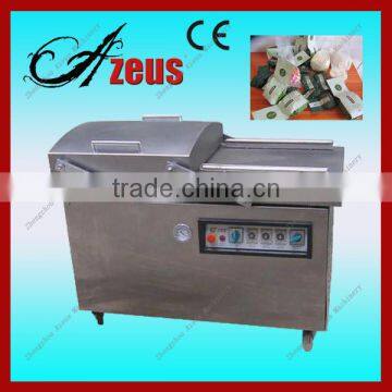 Vacuum packing machine with double chamber