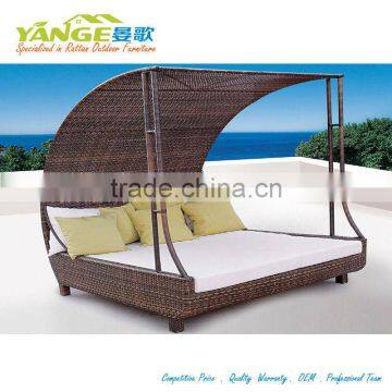 Rattan poolside sunbed with covers