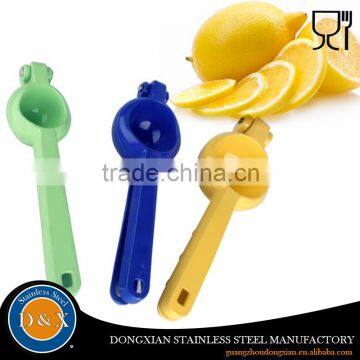 Colorful plastic hand orange juice squeezer