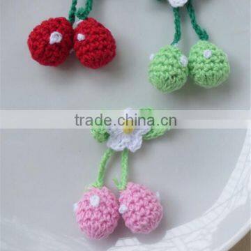 Red and pink handmade crochet strawberries appliques