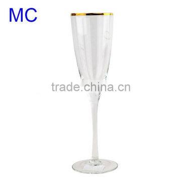 Fashionable champagne glass with gold rim