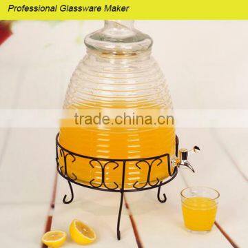 giant glass beverage dispenser with metal decorative rack