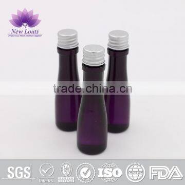 Transparent PVC plastic bottle with purple shampoo for hotel