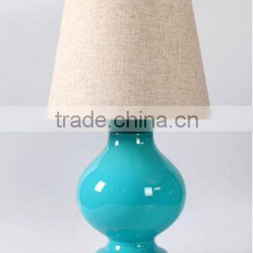 wholesale high end chrome round base glass table lamp with polished surface and barrel linen shade