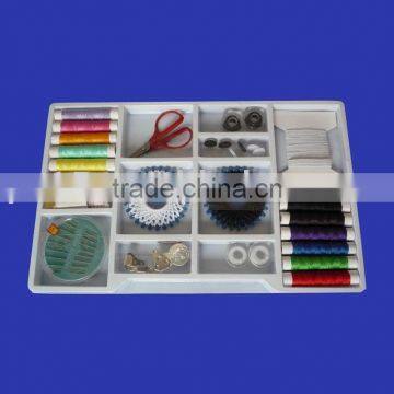 in plastic box sewing kit