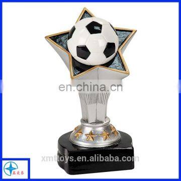 a big star holding a football resin trophy for activities