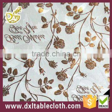 Garden vines embossed pearlescent plastic tablecloth with non-wovn backing