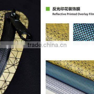 Reflective pattern devorative overlay film for garment bonding and seamless pocket